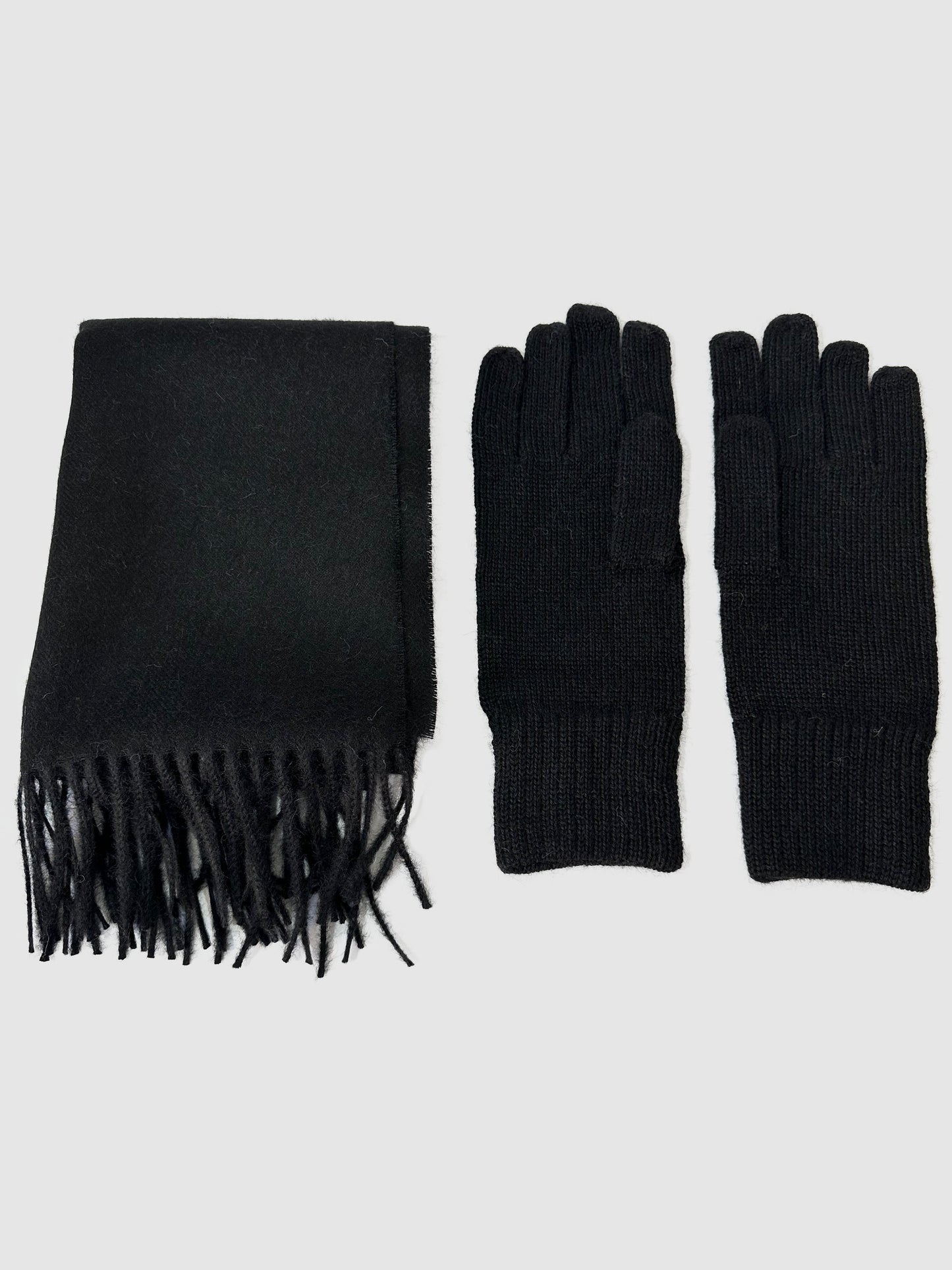 Solid black baby alpaca scarf, hand-finished. Measures 180 cm in length by 30 cm in width. Also, one-size solid black baby alpaca gloves.