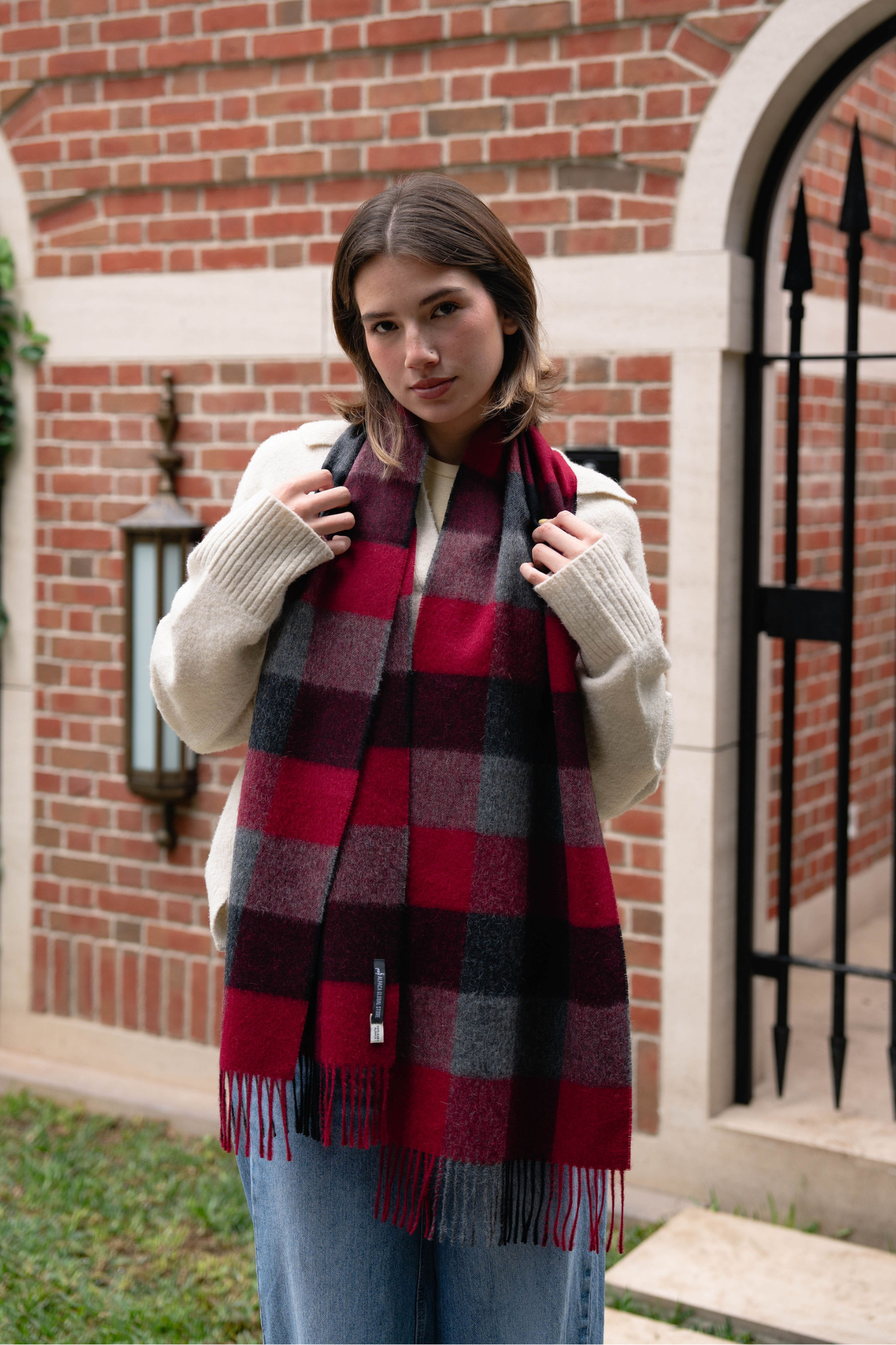 Elegant red plaid scarf for women. A cozy and stylish plaid winter scarf that adds warmth, comfort, and timeless charm to any outfit.