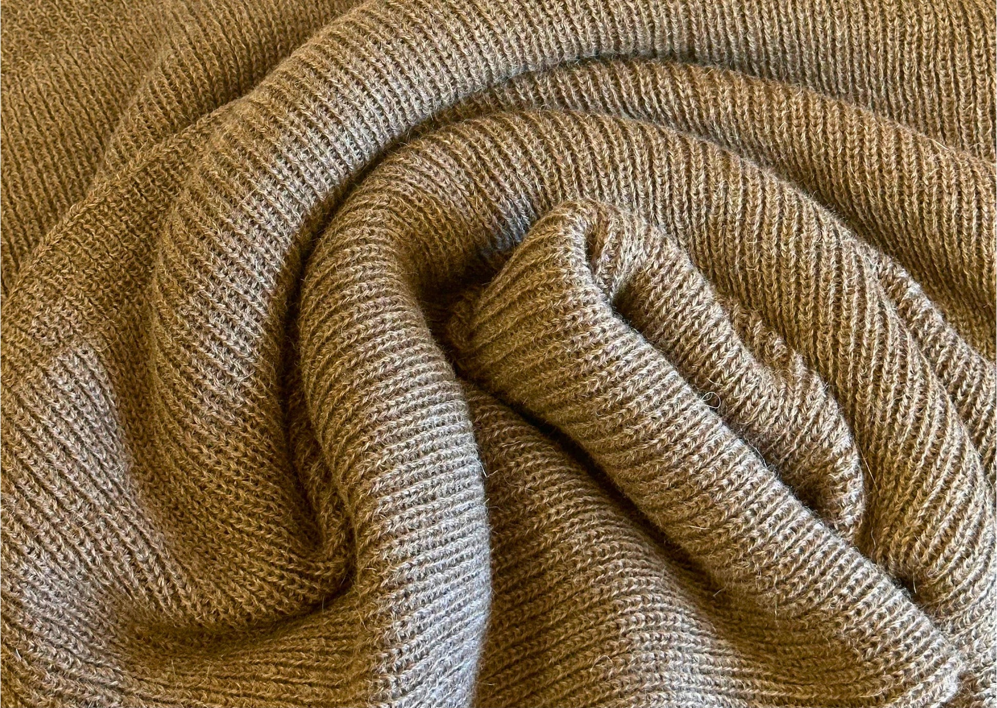 Brown baby alpaca blanket with English knit style.