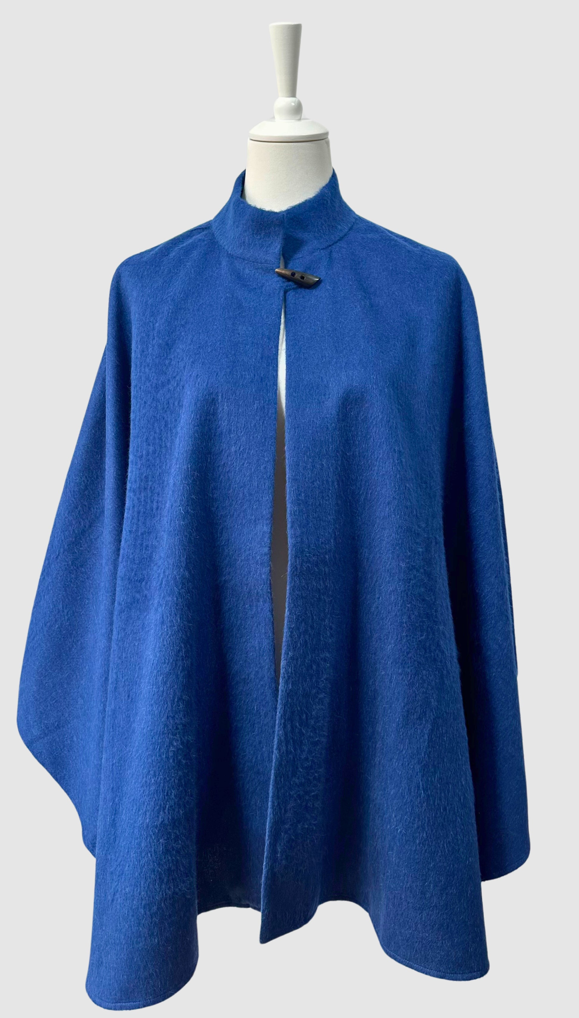 Blue baby alpaca cape made in Peru. One size.