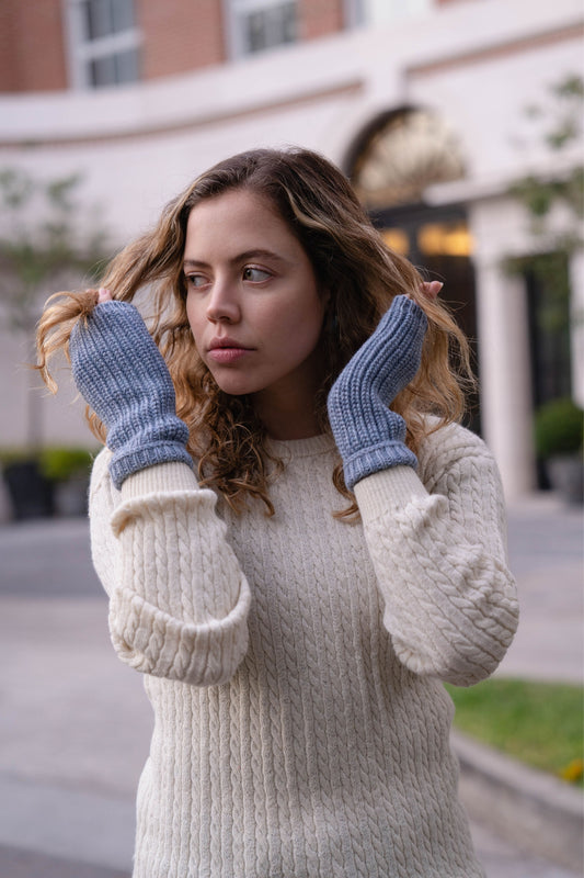 Soft and cozy blue alpaca mittens designed for women. Made from premium alpaca wool, they offer warmth and elegance for chilly winter days.