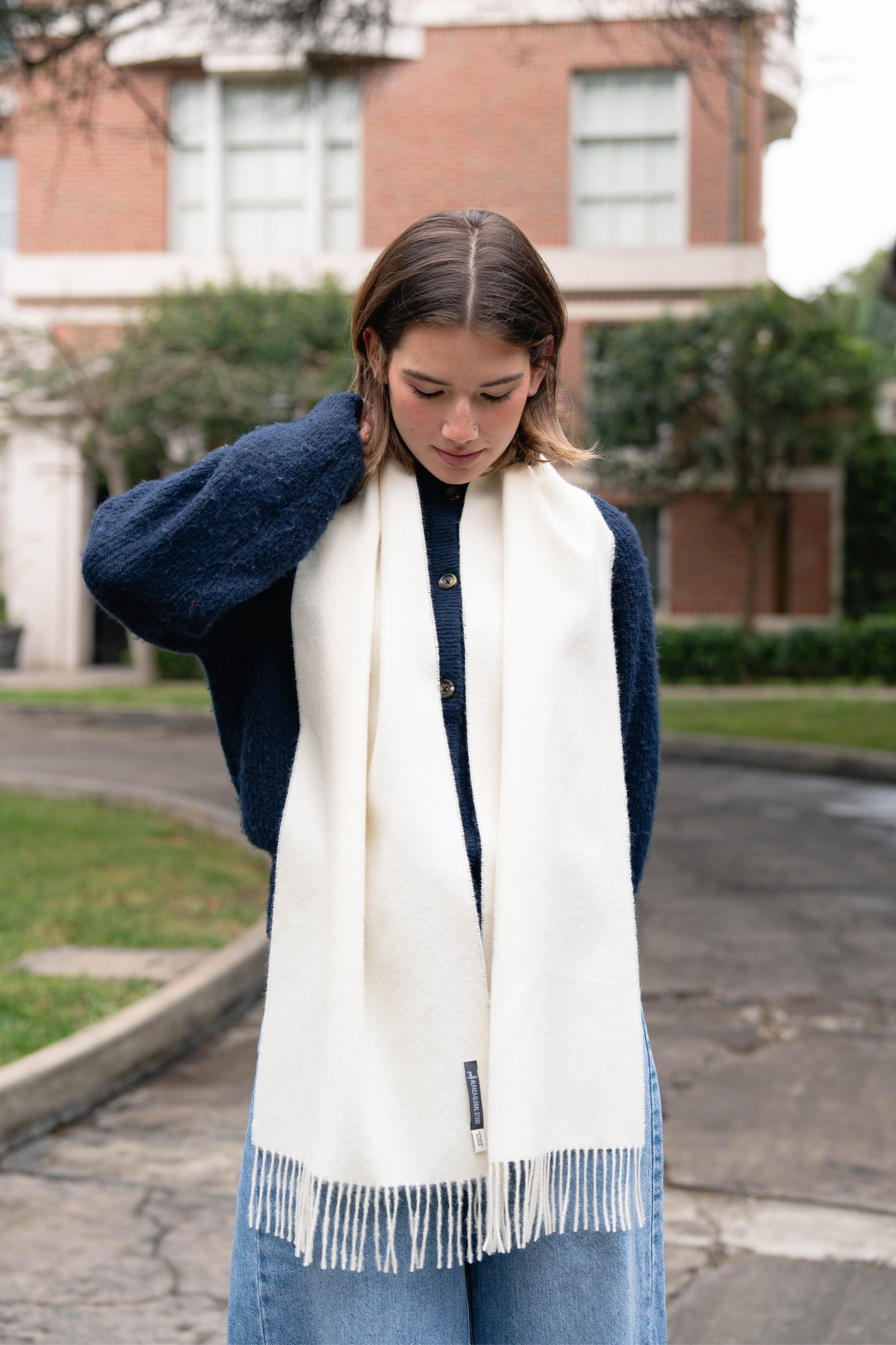 Elegant white alpaca scarf for women, soft, cozy, and stylish. The perfect winter accessory for warmth and sophistication.